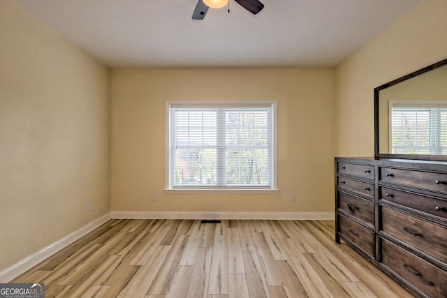 unfurnished bedroom featuring light hardwood / wood-style flooring and ceiling fan