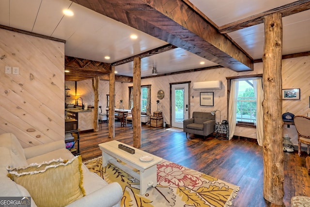 living room featuring a wall mounted air conditioner, wood walls, and dark hardwood / wood-style flooring