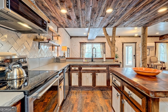 kitchen featuring stainless steel appliances, sink, wood-type flooring, wooden ceiling, and range hood