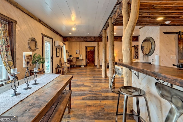 interior space featuring an AC wall unit, wooden walls, wood ceiling, and dark hardwood / wood-style floors