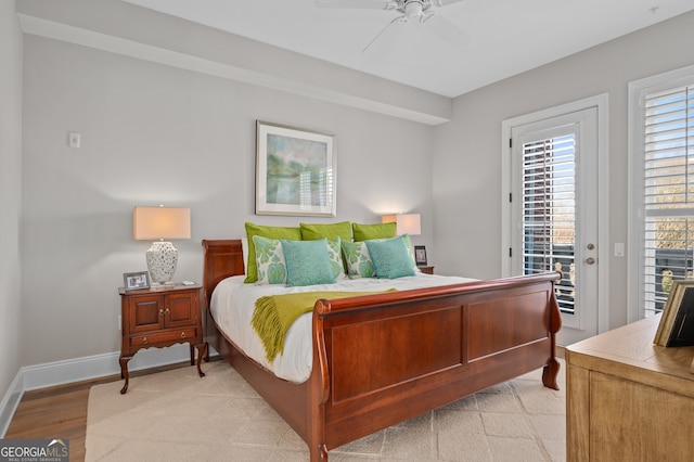 bedroom with access to exterior, ceiling fan, and light wood-type flooring