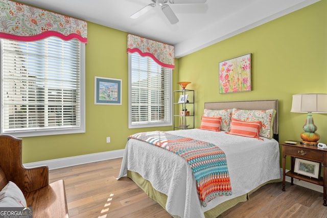 bedroom featuring ceiling fan and light hardwood / wood-style floors