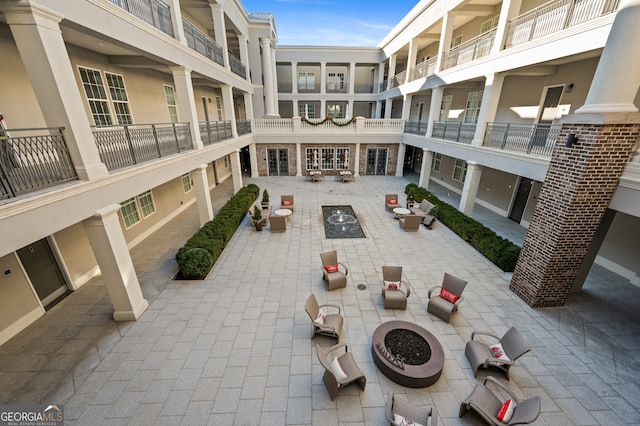 view of property's community featuring a fire pit