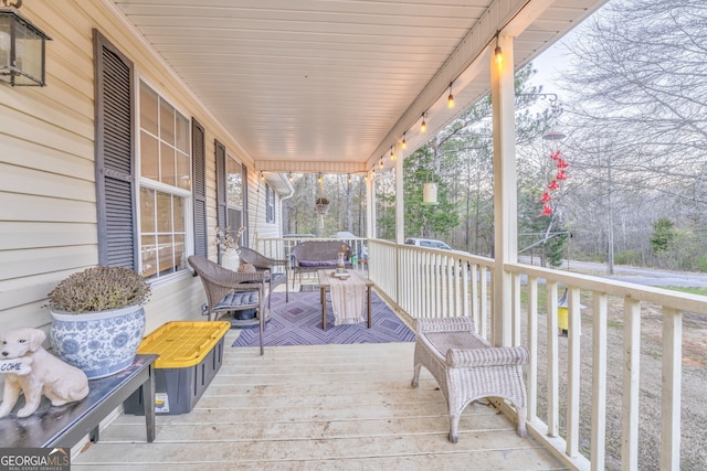 wooden deck featuring covered porch