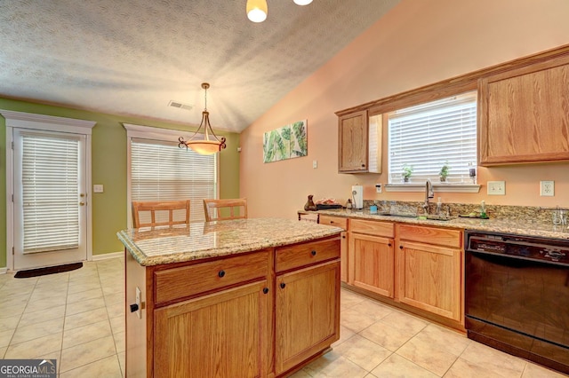 kitchen with dishwasher, sink, decorative light fixtures, vaulted ceiling, and light tile patterned flooring