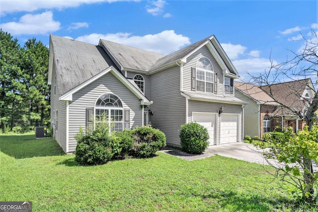 front of property featuring a front yard, a garage, and cooling unit