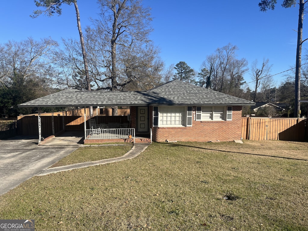 single story home with a carport and a front lawn