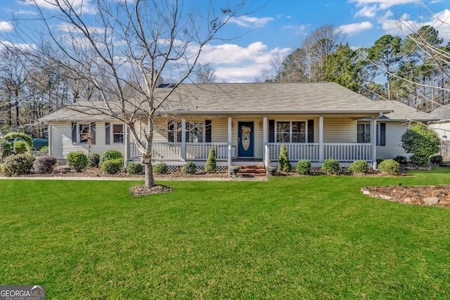 single story home with a porch and a front yard