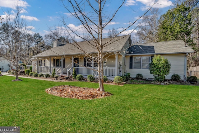 single story home with a porch and a front lawn