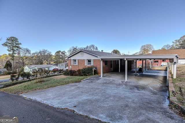 single story home with a carport