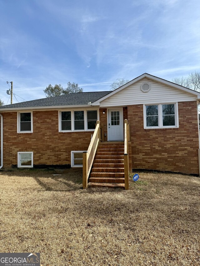 back of house with a yard