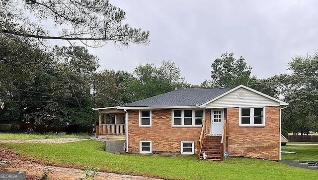 rear view of house with a yard