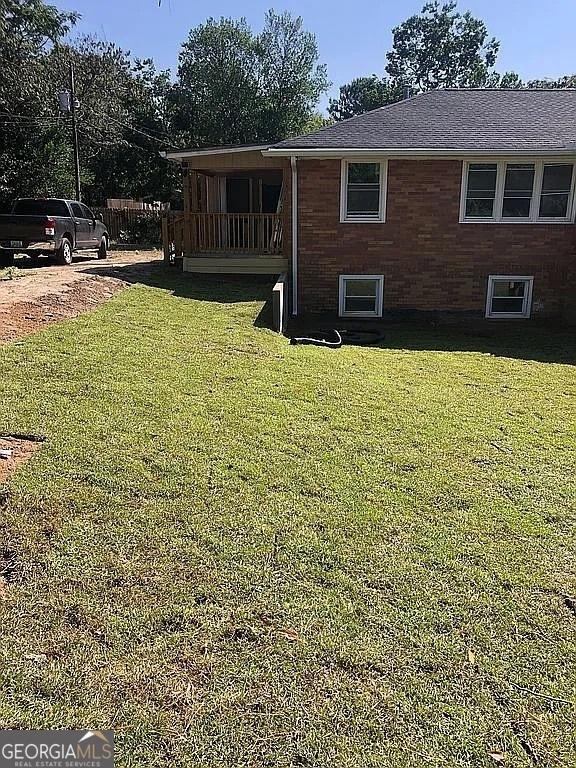 view of home's exterior with a yard