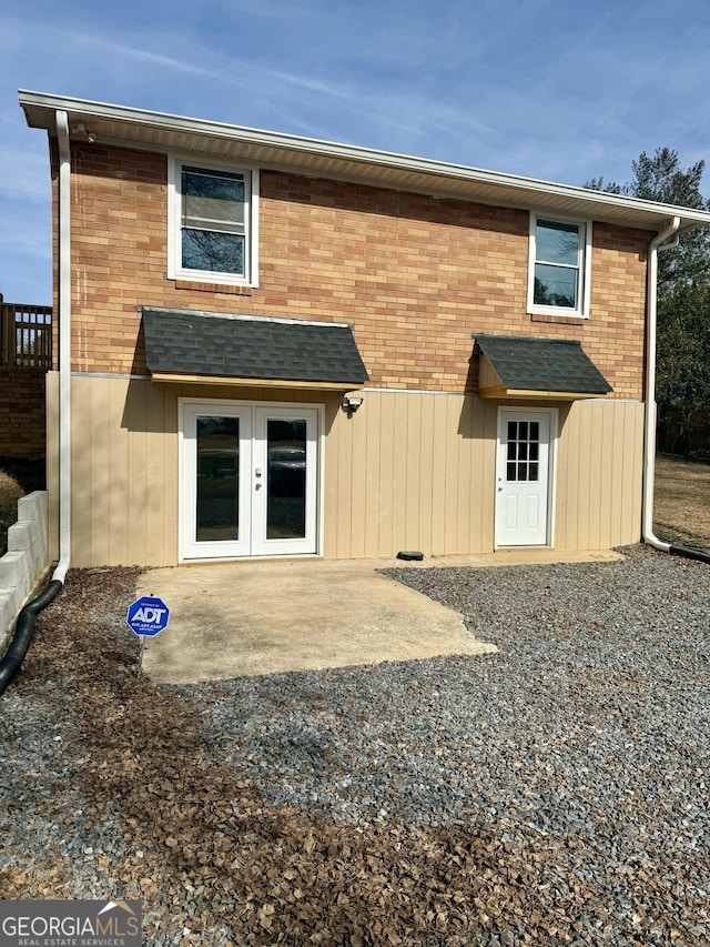 back of property featuring a patio area and french doors