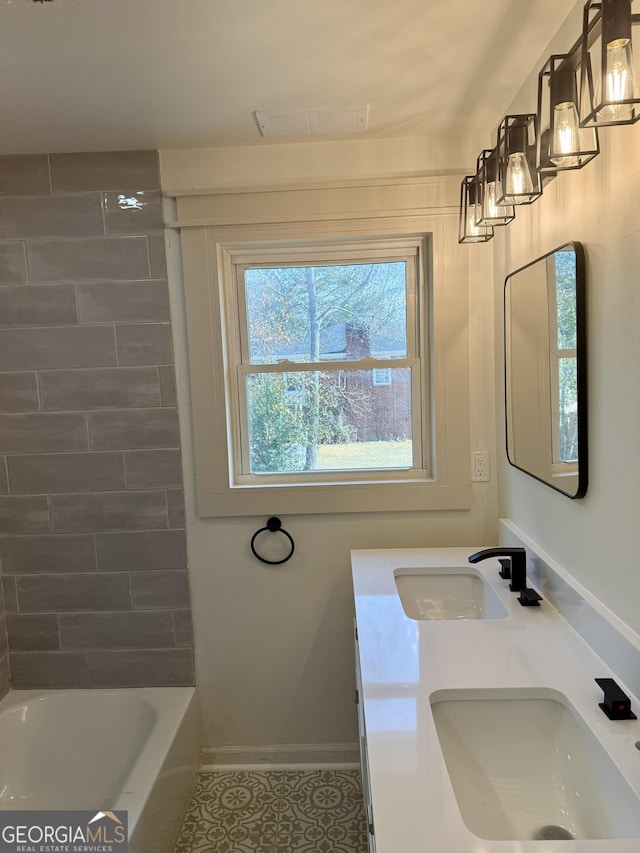 bathroom featuring tile patterned flooring and vanity