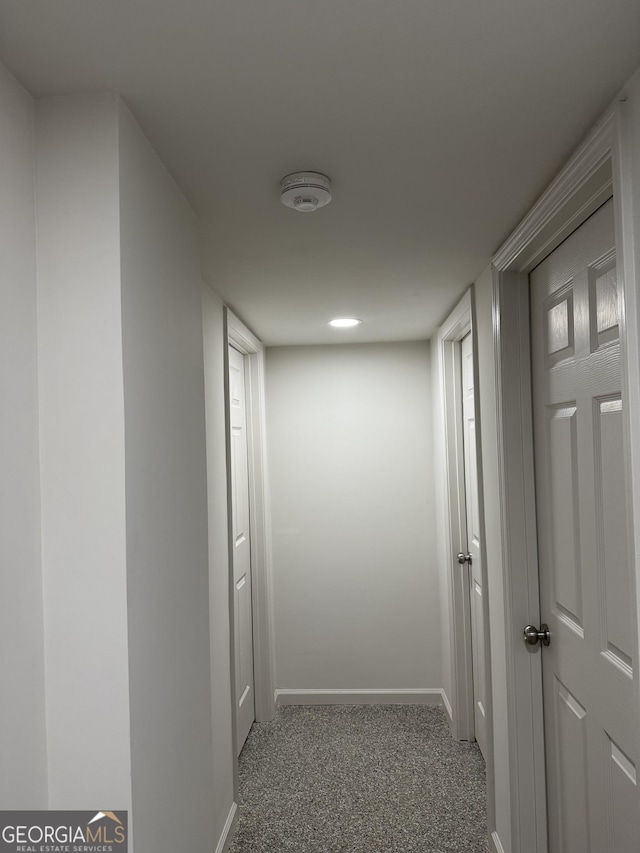 corridor with light colored carpet