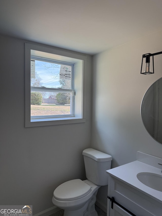 bathroom with vanity and toilet