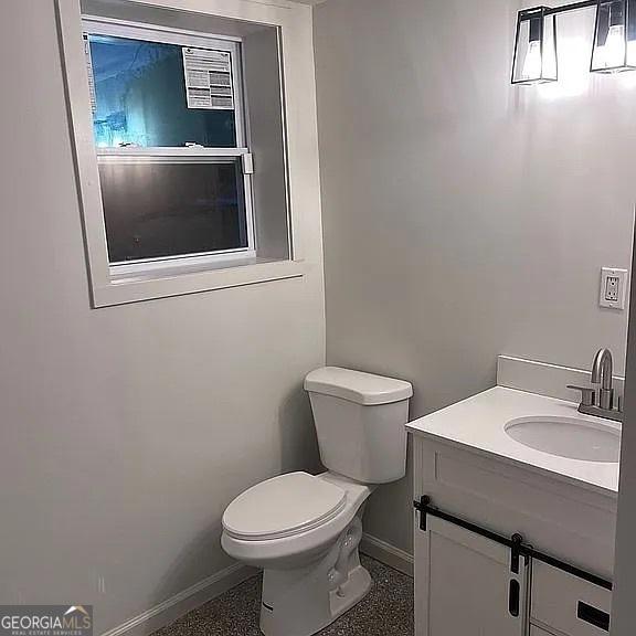 bathroom with vanity and toilet