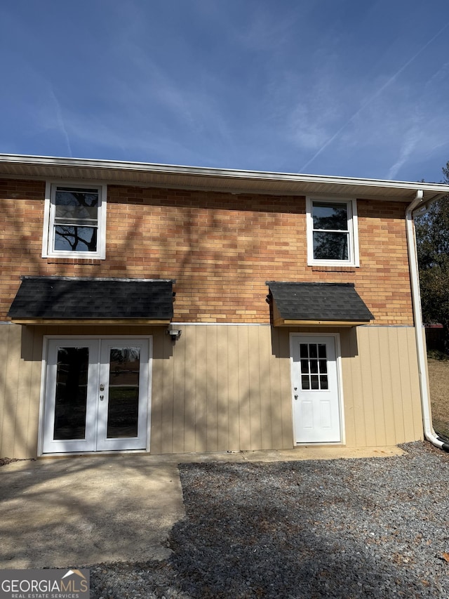 back of property featuring french doors and a patio