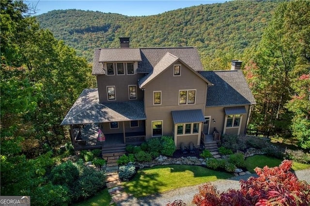 view of front of home featuring a mountain view