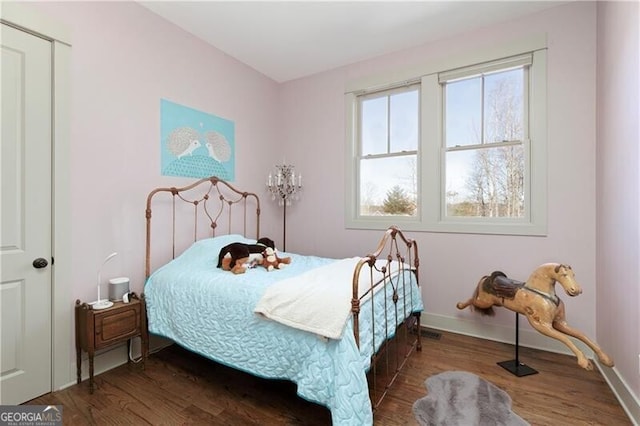 bedroom with hardwood / wood-style floors
