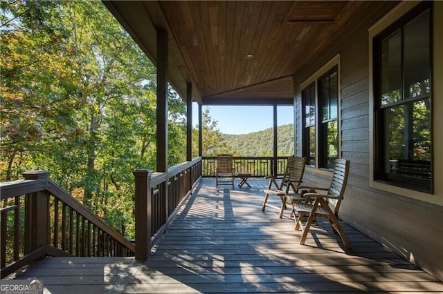 wooden terrace featuring a mountain view