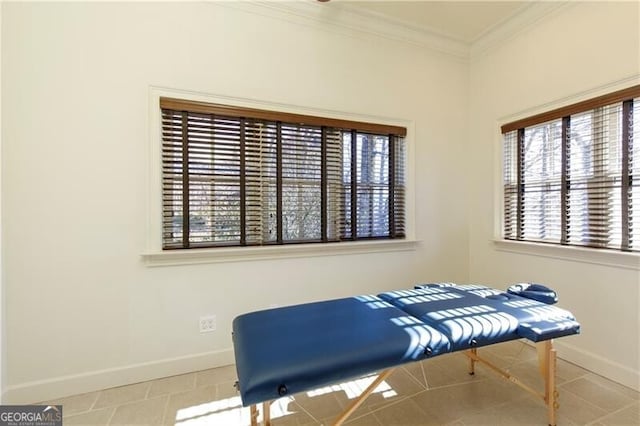 living area with light tile patterned floors and ornamental molding