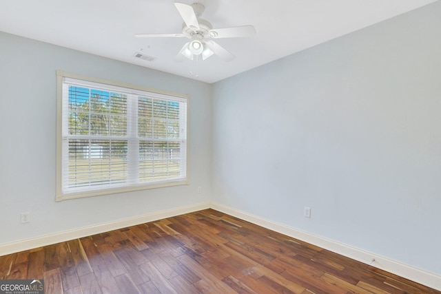 empty room featuring dark hardwood / wood-style floors and ceiling fan