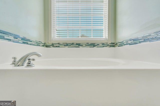 bathroom with a washtub