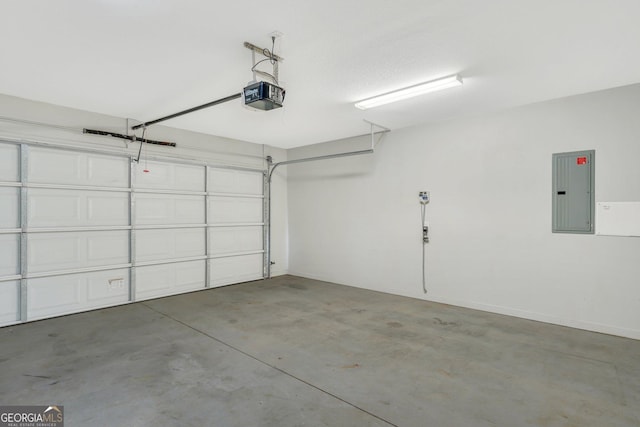 garage featuring electric panel and a garage door opener