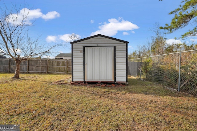 view of outdoor structure featuring a yard