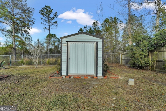 view of outbuilding with a yard