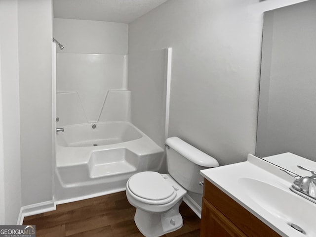 full bathroom with hardwood / wood-style flooring, vanity, toilet, and bathing tub / shower combination