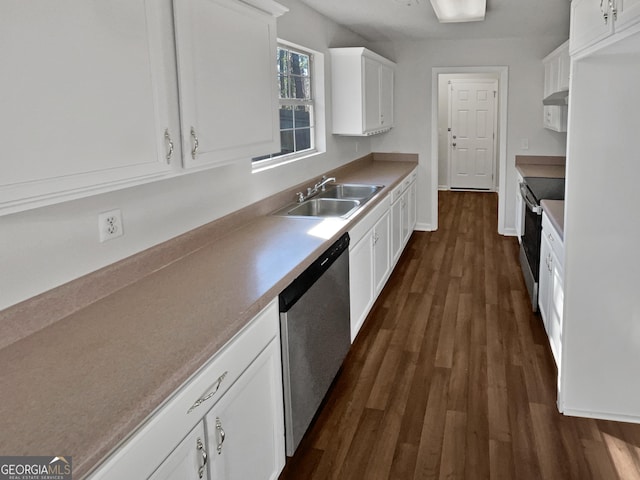 kitchen featuring sink, white cabinets, dark wood-type flooring, and appliances with stainless steel finishes