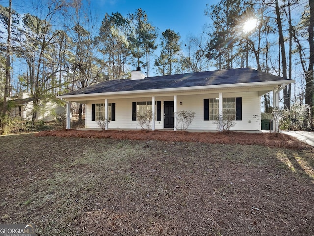 single story home with covered porch