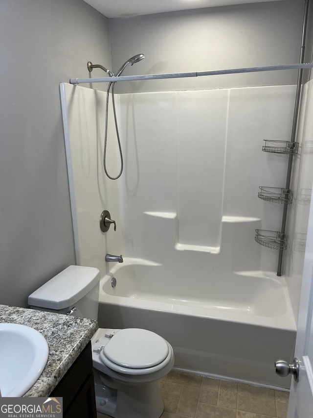 full bathroom with vanity, shower / bathtub combination, and toilet