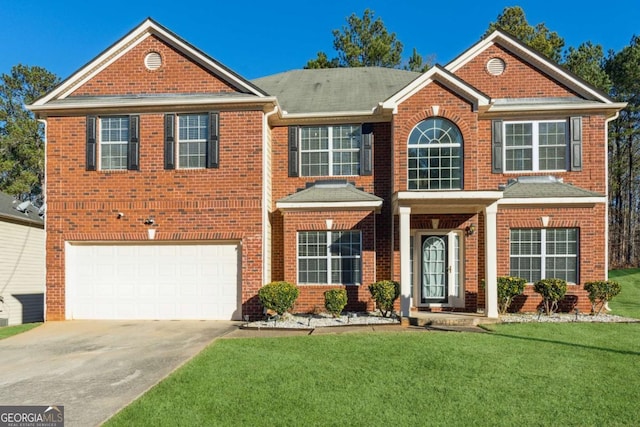 view of front of home featuring a garage and a front lawn