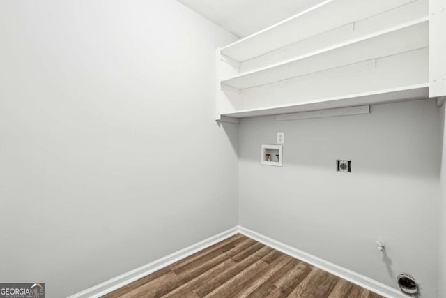 clothes washing area featuring washer hookup, electric dryer hookup, and dark hardwood / wood-style flooring