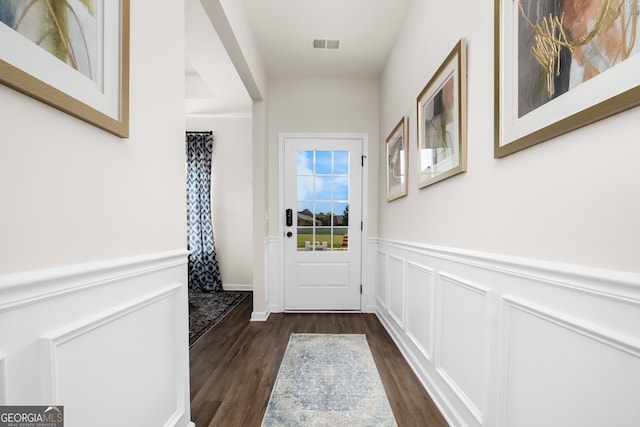 doorway to outside featuring dark wood-type flooring