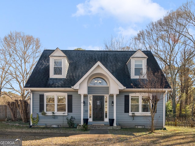 new england style home with a front yard