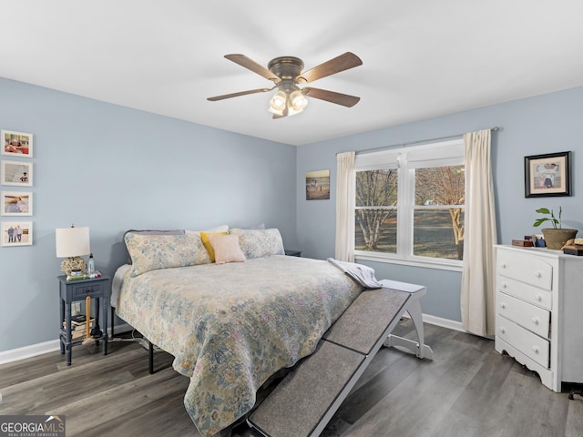 bedroom featuring ceiling fan and dark wood-type flooring