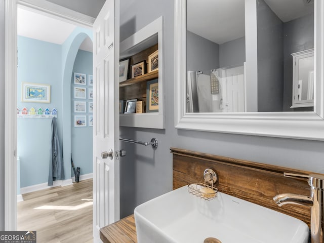 bathroom with sink and hardwood / wood-style floors