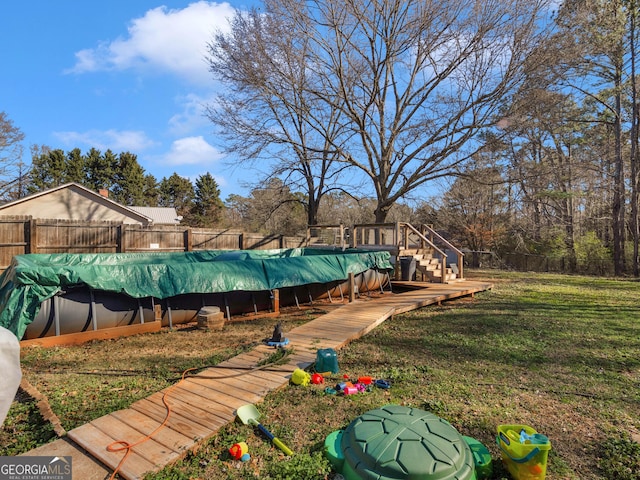 view of yard with a covered pool