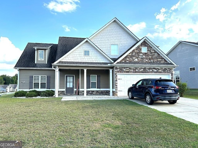 craftsman house featuring a garage, covered porch, and a front lawn