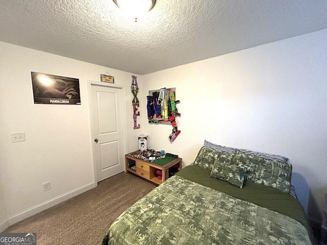 bedroom with carpet and a textured ceiling