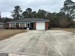 single story home featuring a garage