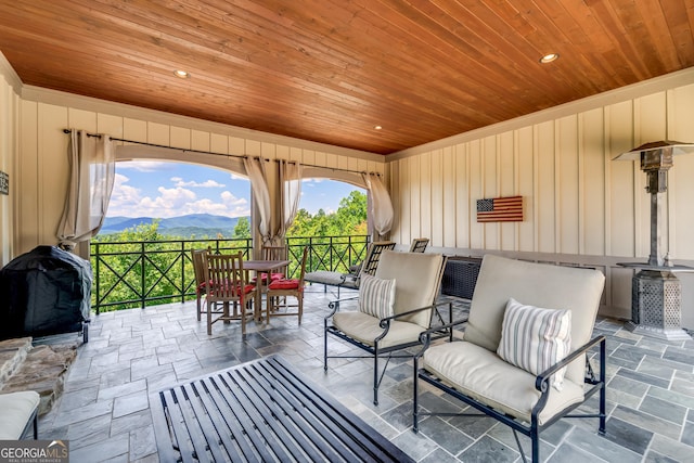 view of patio with a mountain view and an outdoor living space