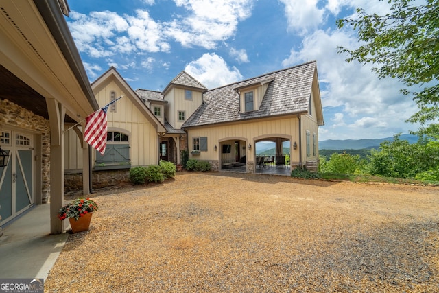 rear view of property with a mountain view