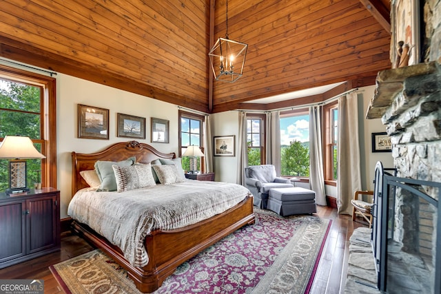 bedroom featuring dark hardwood / wood-style flooring, high vaulted ceiling, an inviting chandelier, and wooden ceiling