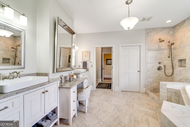 bathroom featuring vanity and separate shower and tub